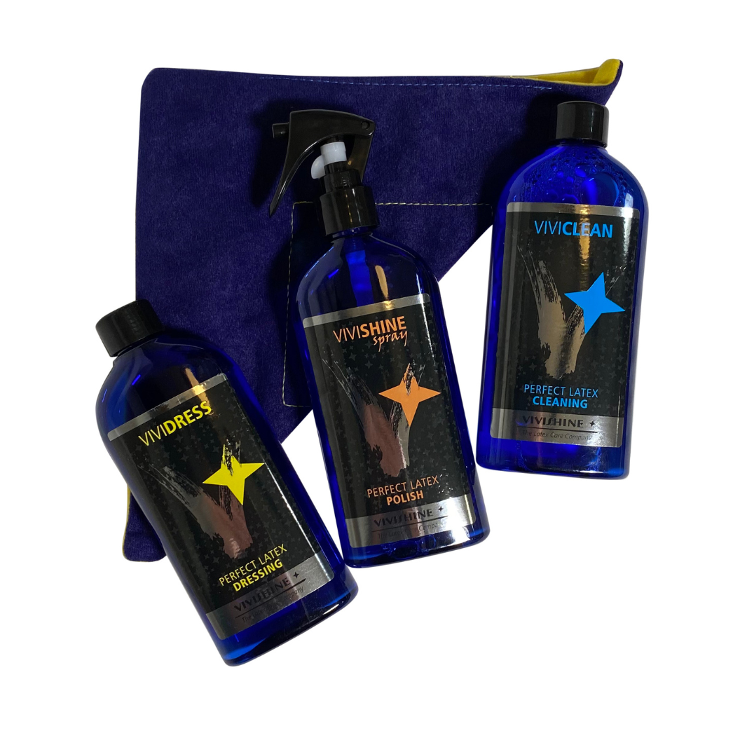 Latex Care Bundle Latex Fashion by Vex Three blue bottles from the Latex Care Bundle are arranged next to a folded blue and yellow cleaning cloth. The bottles contain latex care products labeled Vivdress, Vivishine Spray, and Viviclean.